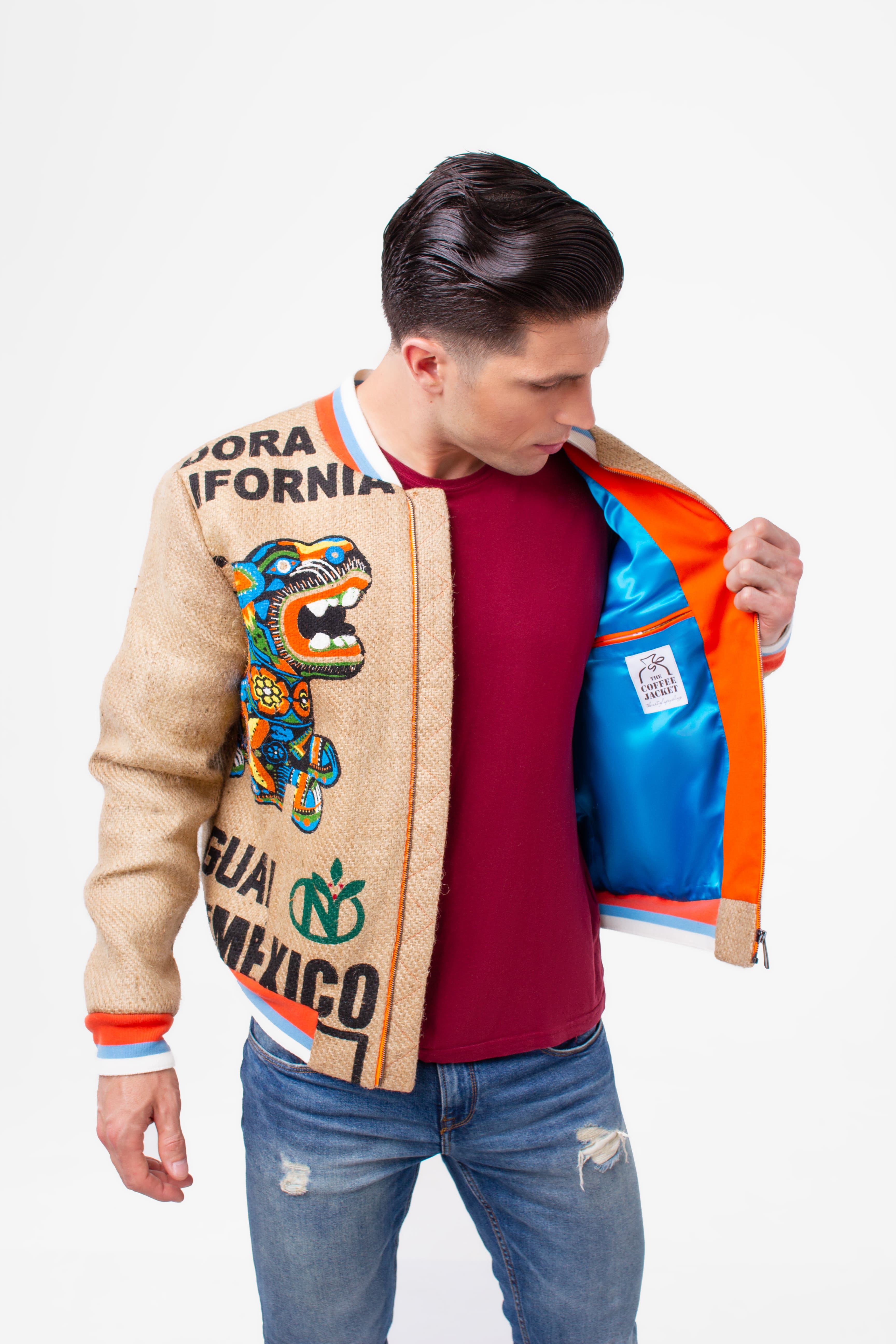 A young man showing the inner workings of his eye-catching sustainable unisex college jacket
