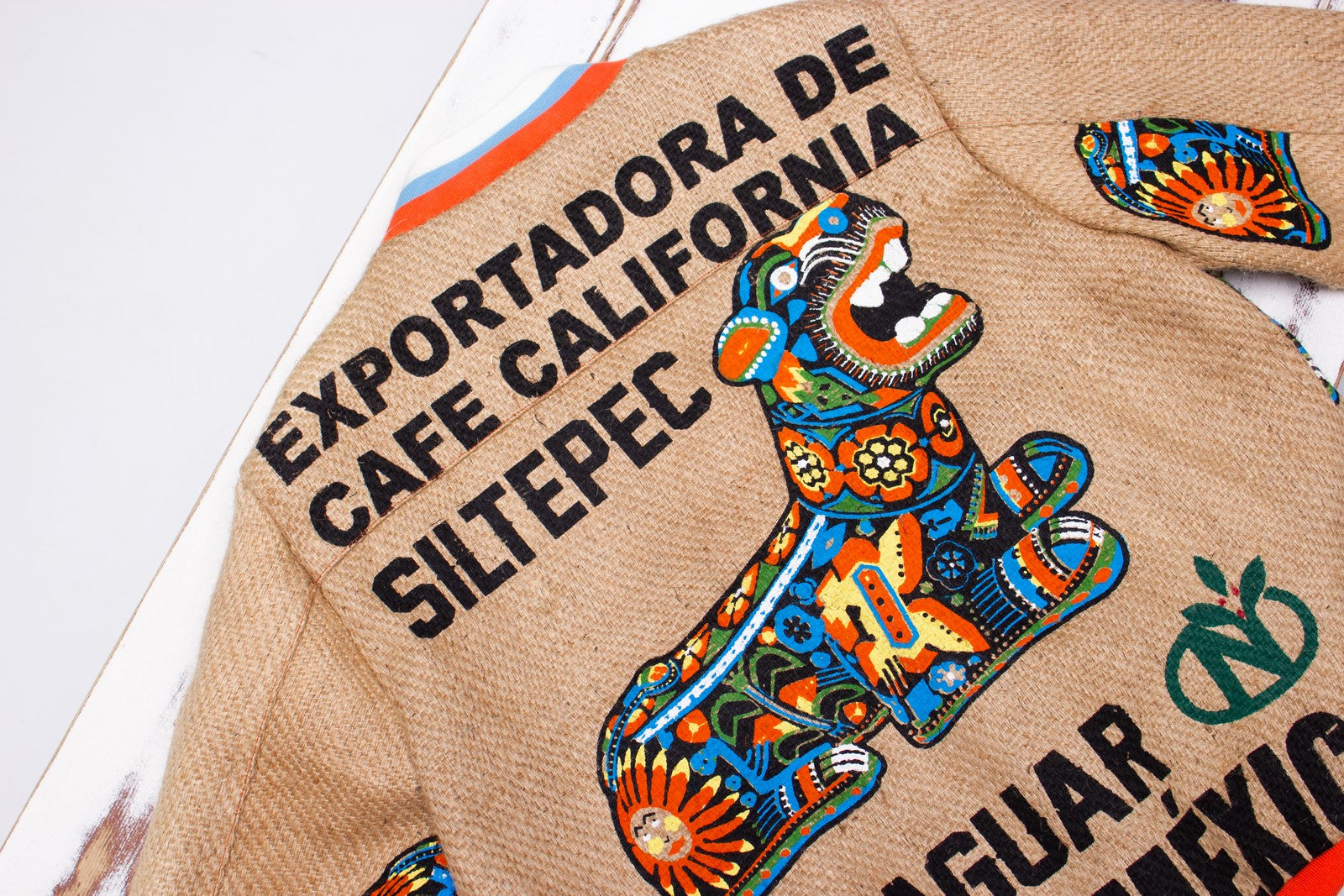 Eco-jacket with a colourful jaguar print of a coffee sack