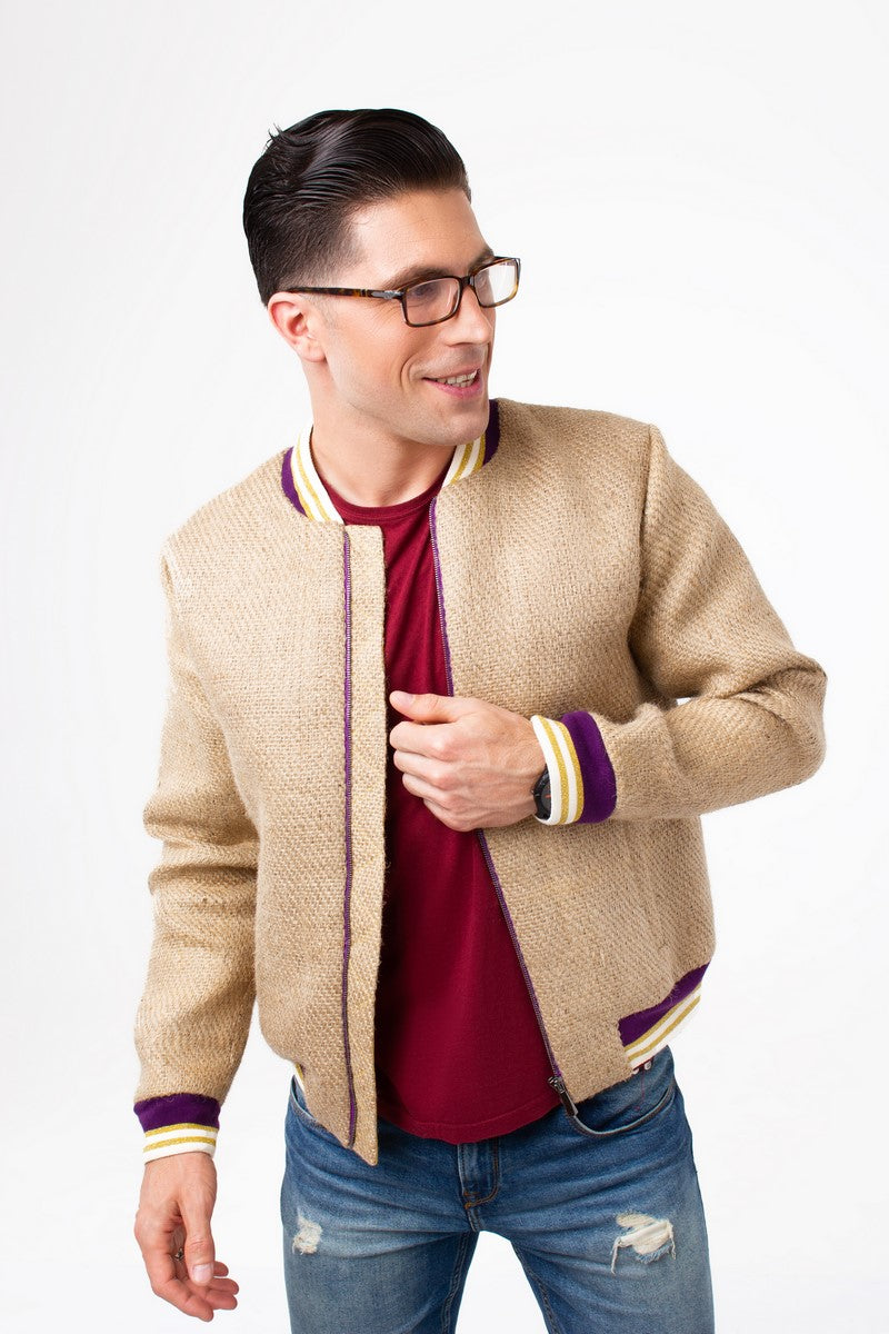 A man wearing an exclusive outerwear piece made of used coffee sacks from German sustainable fashion brand THE COFFEE JACKET®
